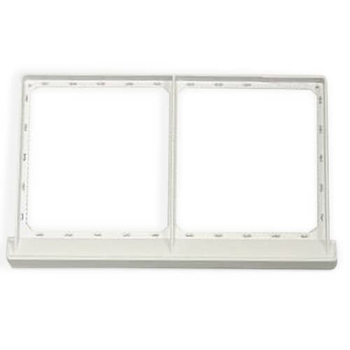 The white plastic frame of the lint trap assembly shown against a white background, outlining the dual rectangular filter sections.