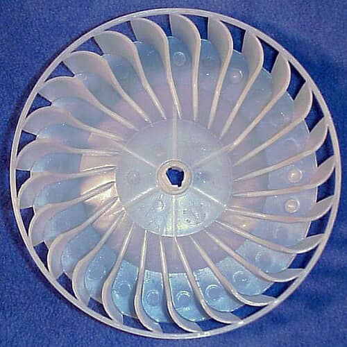 A light beige plastic dryer blower wheel shown from the front, featuring curved blades and a central hub opening on a white background.