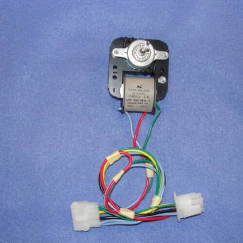 The evaporator motor assembly resting on a white grid, showing the attached wiring harness spread out.