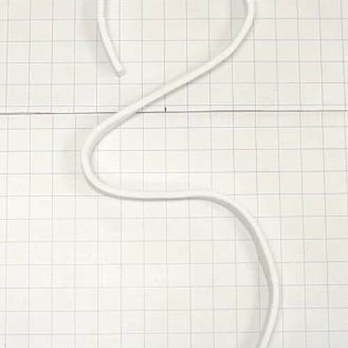 A section of the felt seal lying straight across a white grid, showing the texture and thickness of the material.