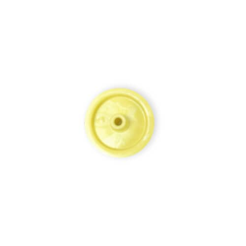 A top-down view of the yellow plastic pulley wheel, showing the central mounting hub.