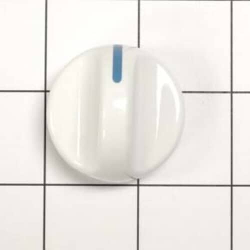 A top-down view of the flame detector against a white grid, highlighting the black body and gold electrical tabs.