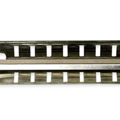 The metal heater assembly shown against a blue surface with a white grid pattern, highlighting the structure.