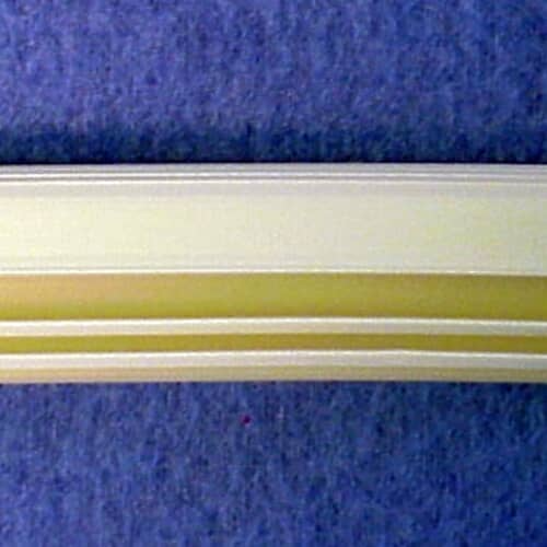 Close-up view of GE WD8X229 dishwasher door gasket cross-section showing rubber sealing edge.