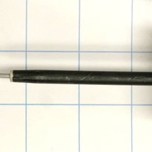 An angled view of a surface heating element showing its coiled wires and terminal block.