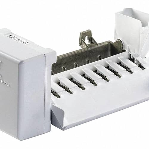 The ice maker module shown with its attached wiring harnesses and small clips, set against a white grid.