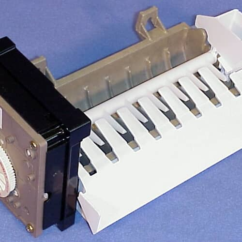 A close-up view of the ice mold section showing the white ejector blades against a dark interior lining and a blue background.