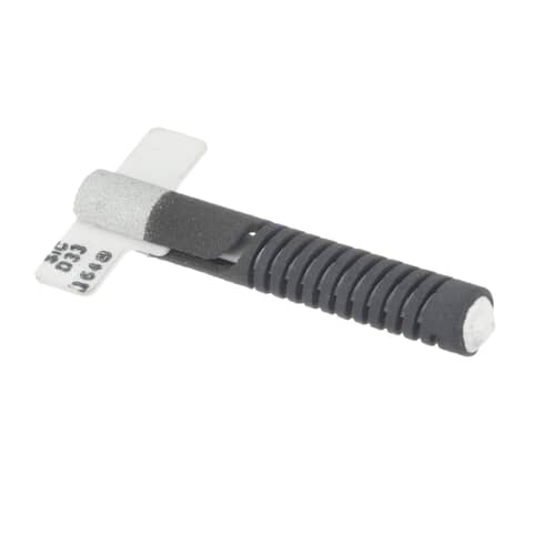 Angled view of the ignitor showing the gray protective sheath, the white mounting tab with writing, and the glowing tip.