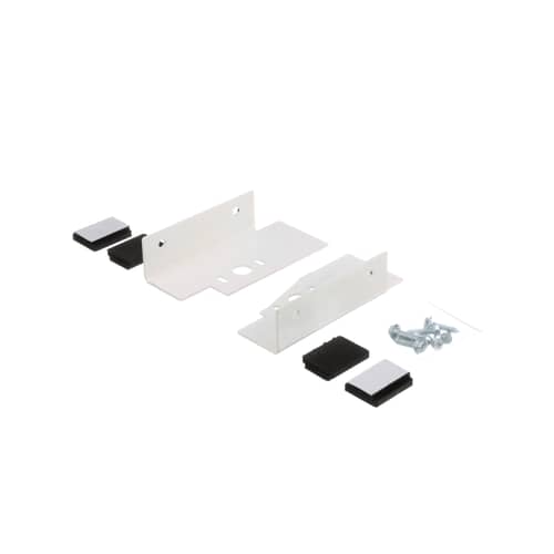 The full GE stacking kit laid out, showing two white metal brackets, four black feet, and a small bag of screws.