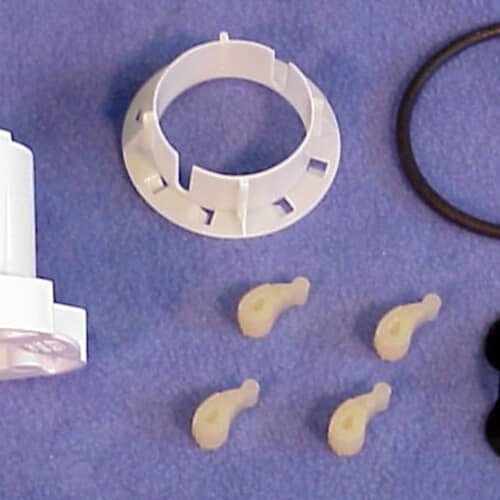 Close-up of the white plastic cam pieces and seal from the 285811 agitator repair kit