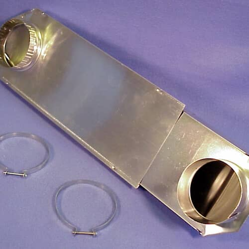 View of the telescoping dryer vent component resting on a surface, highlighting the smooth metal duct construction.