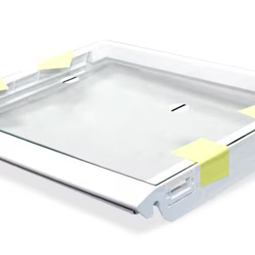 Close-up of Whirlpool W10508993 part number label on glass shelf edge