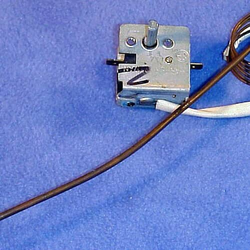 A black rubber grate foot pad with a mounting hole in the center.