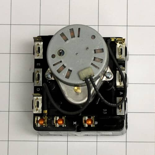 The back of the Electrolux dryer timer against a white grid, showing the metallic motor housing and various electrical connection tabs.