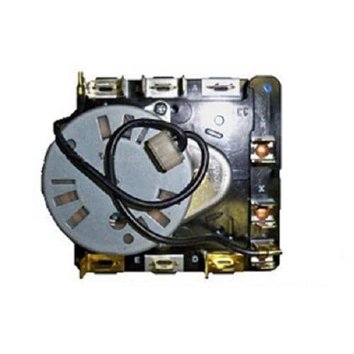 An overall view of the timer component against a white grid, highlighting the small, silver circular timing motor.