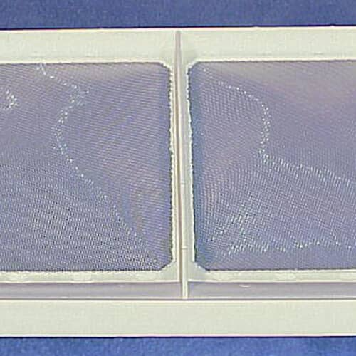 Close-up of the mesh filter material within the white frame of the lint trap, set against a pale blue background.