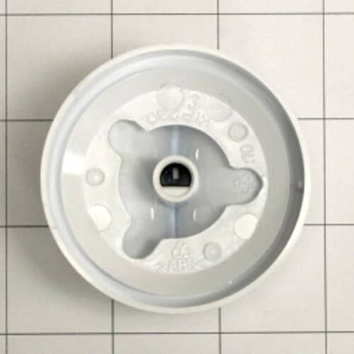 The rear view of the white timer knob showing the mounting hub and retention markings against a white grid.