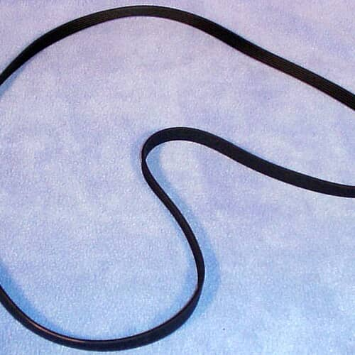 A section of the black multi-ribbed drive belt laid out in an S-curve shape on a light blue, textured surface.