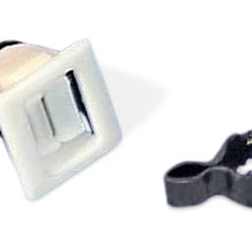 Close-up of the separate components: the switch housing and the metallic retaining clip, against a white background.