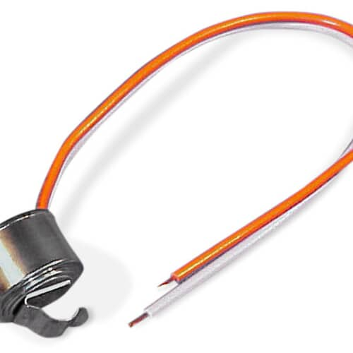 A side view of the metallic sensor component with attached leads, showing the curved mounting tab.