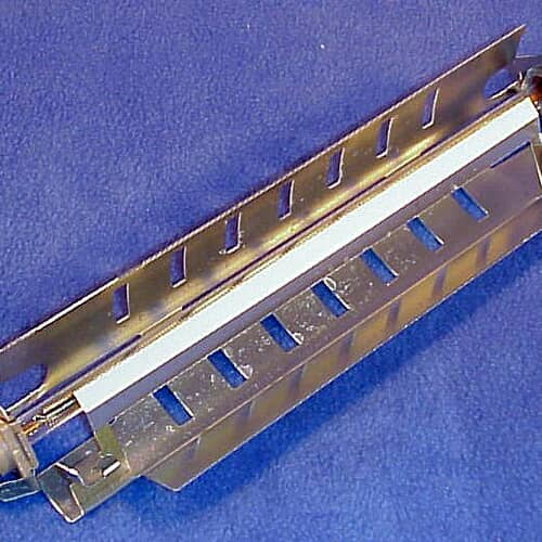 Close-up view of the metallic housing of the GE heater assembly, showing slotted openings for air/heat flow.