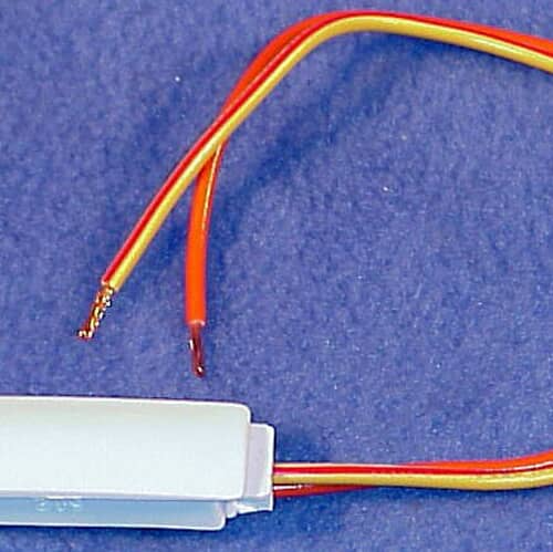 Close-up of GE WH12X10141 lid switch assembly wires and terminals.