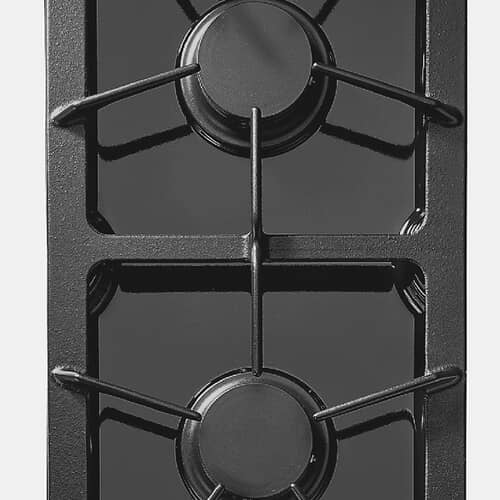 Close-up of black gas cooktop grates and burners