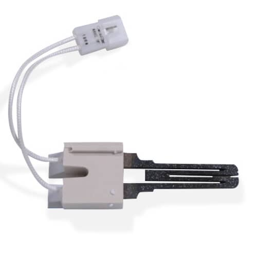 A close-up of the heater igniter against a white grid, showing the light-colored ceramic base and dark heating elements.