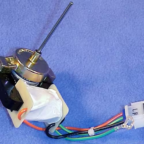 GE WR60X10172 motor installed behind refrigerator evaporator panel