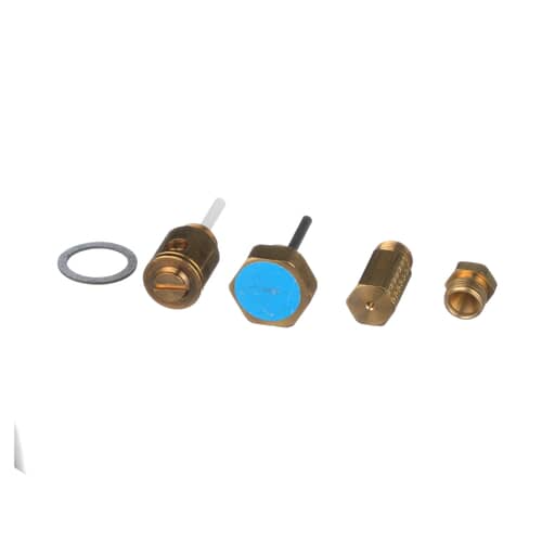 Close-up view of the various brass orifices and fittings included in the gas conversion kit.