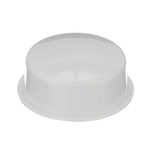 Angled view of the white, circular push button assembly showing the slight dome shape.