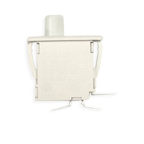 Top view of the white rectangular switch body showing the clips and terminals against a grid