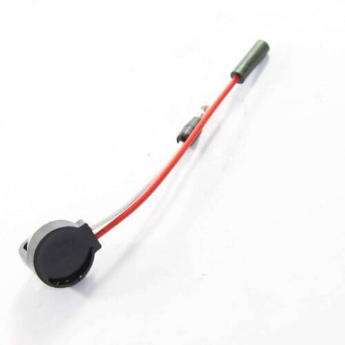 The thermostat assembly resting on a blue surface, highlighting the red and white wire colors.