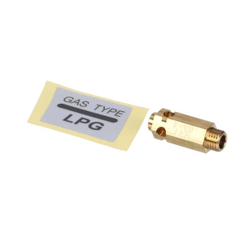 Close-up of the brass LP orifice, labeled P-CU LPG, next to the instruction sheet