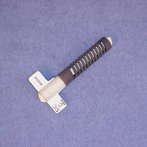 GE WE4X444 ignitor shown at an angle against a measurement grid