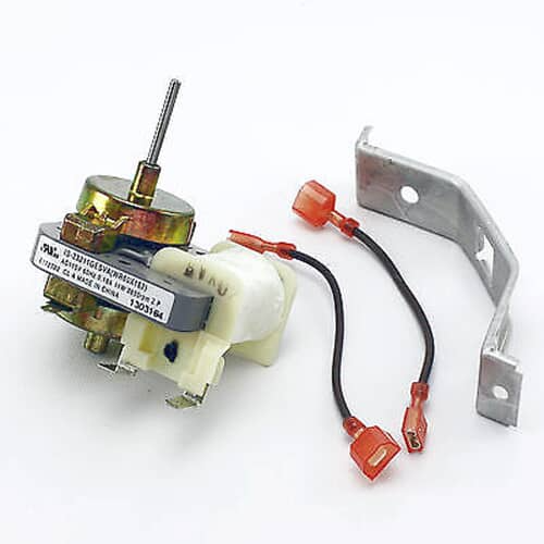 An angled view of the GE WR60X162 evaporator fan motor highlighting the coil and terminals.