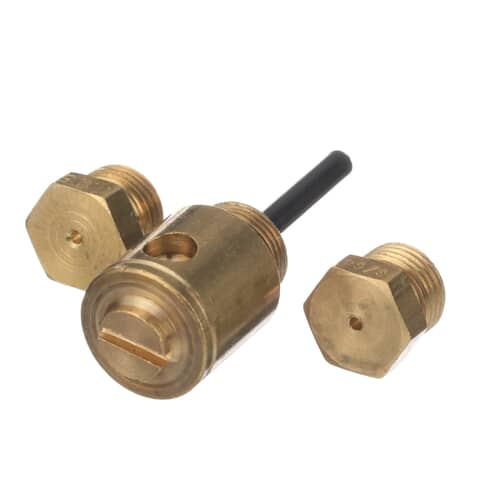 Close-up of the conversion components including the main valve body with black control rod and two external hexagonal brass orifice fittings.